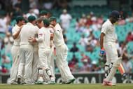 SYDNEY, AUSTRALIA - JANUARY 10:  Australian captain Steven Smith (L) dives to catch out Rohit Sharma of India during day five of the Fourth Test match between Australia and India at Sydney Cricket Ground on January 10, 2015 in Sydney, Australia.  (Photo by Daniel Munoz/Getty Images)
